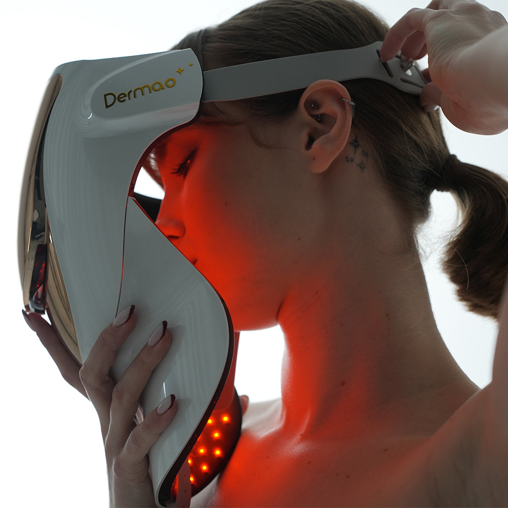 Side view of woman putting on Dermao Halo LED Mask