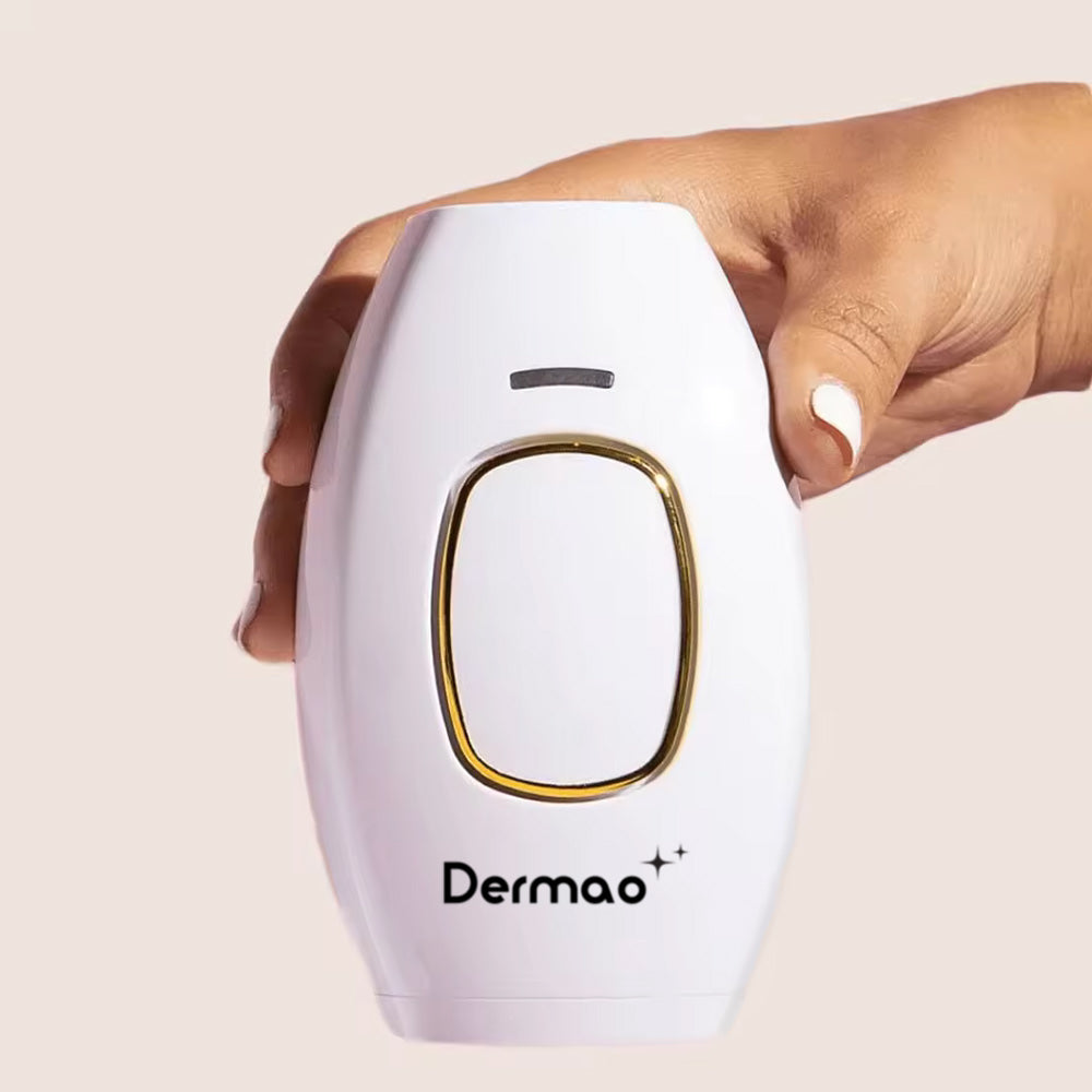 Hand with white nails holding up Dermao IPL