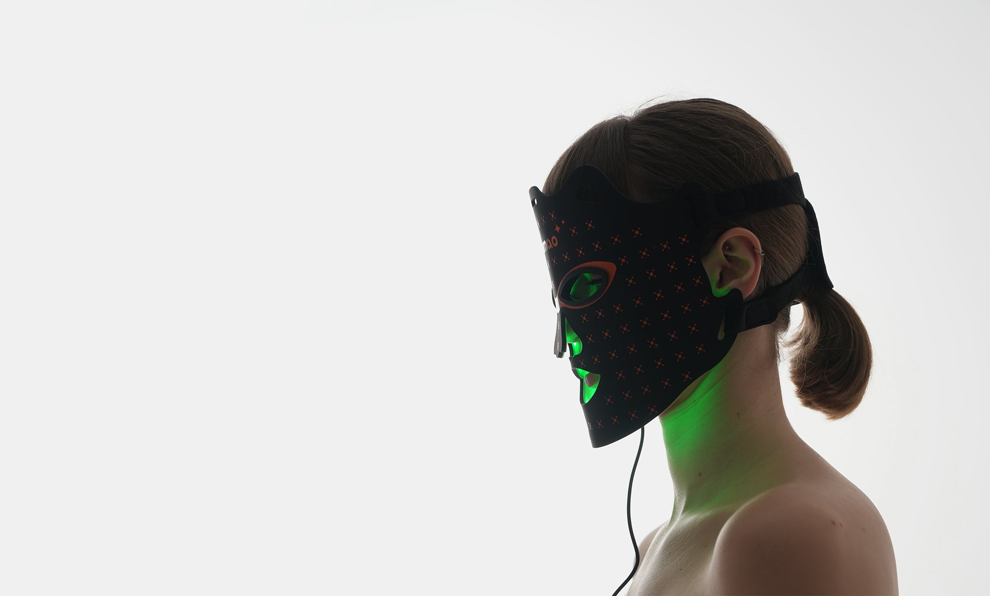 Side profile of woman wearing Dermao Glow LED Mask