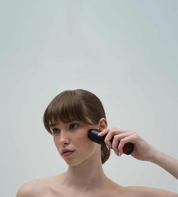 Woman demonstrating Dermao Radiance Microsculpt