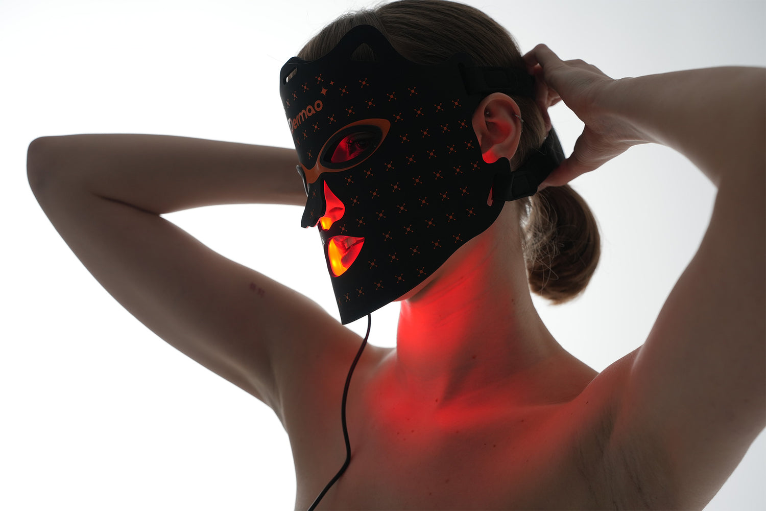 3/4 profile of woman wearing Dermao Glow LED Mask