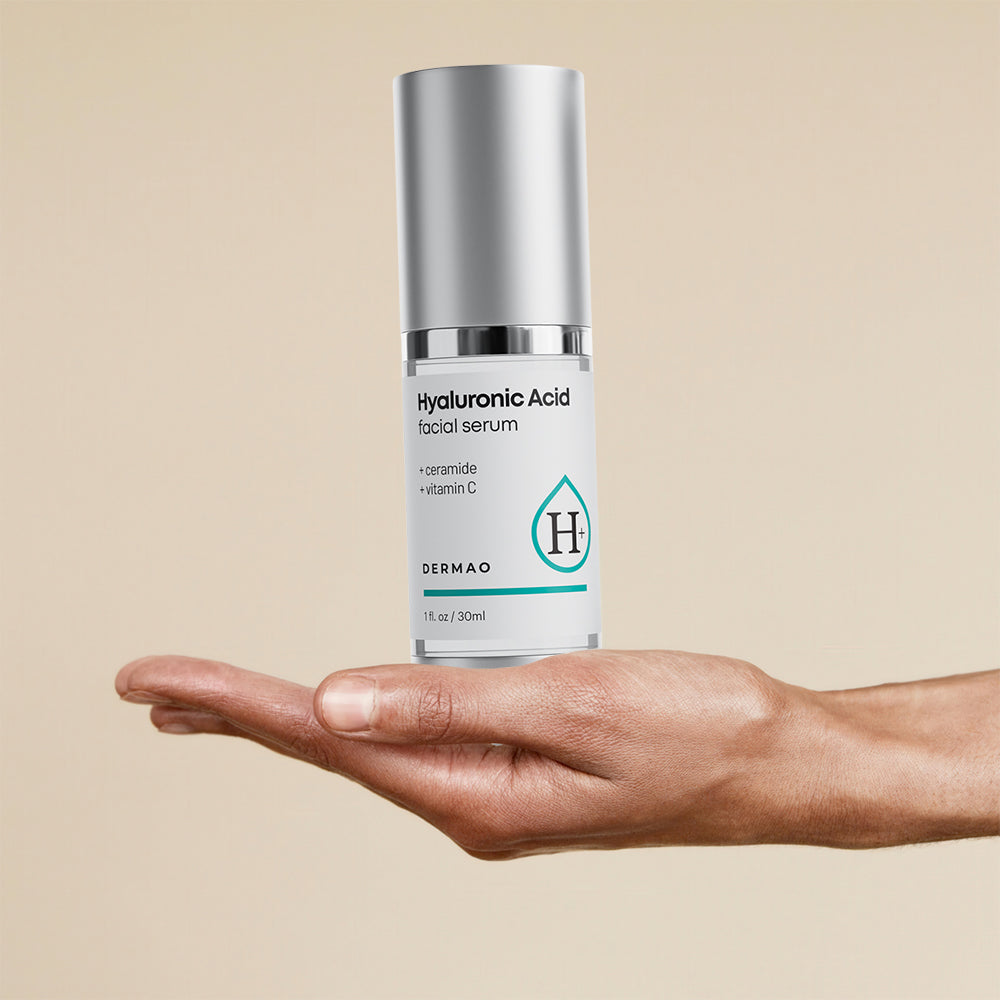 Hand holding up Hyaluronic Acid Facial Serum
