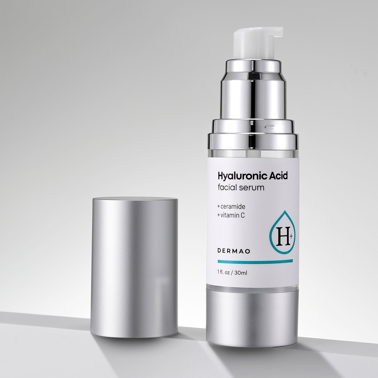 Hyaluronic Acid Facial Serum bottle with silver cap on a gray background