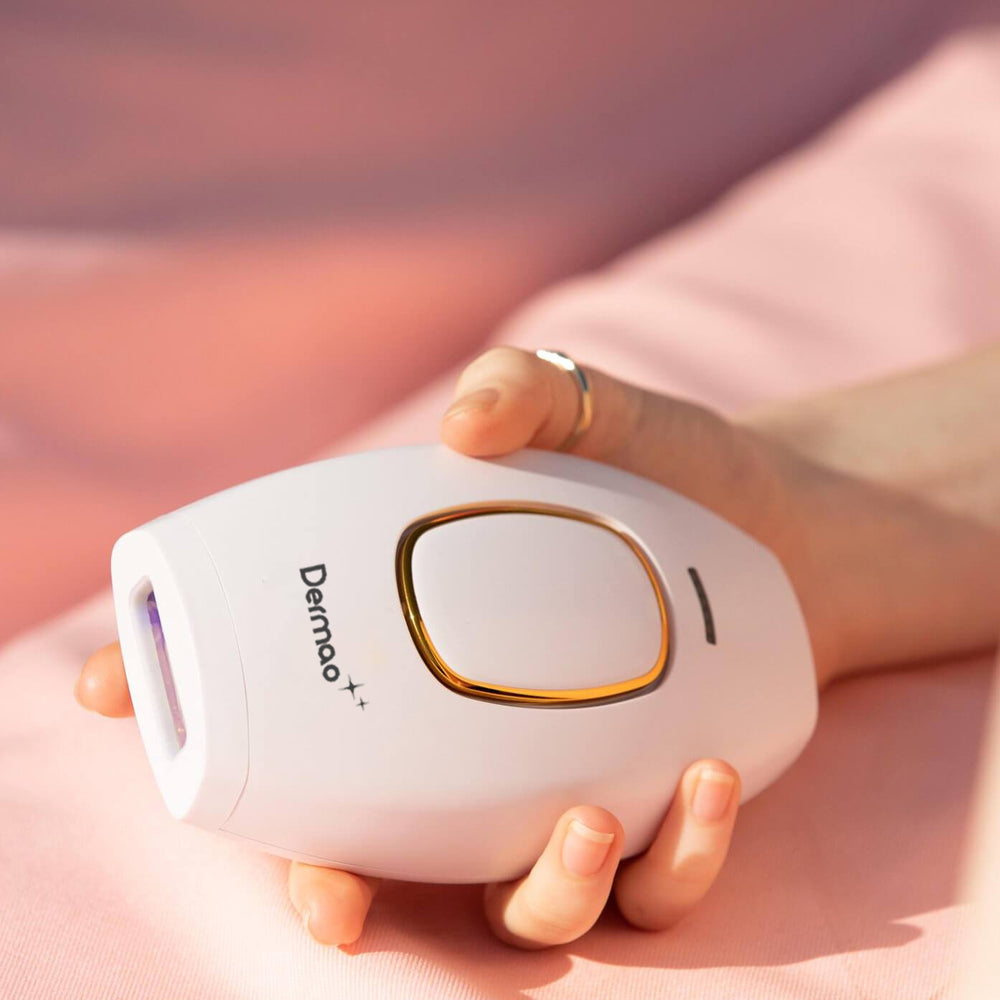 Closeup of hand holding Dermao IPL