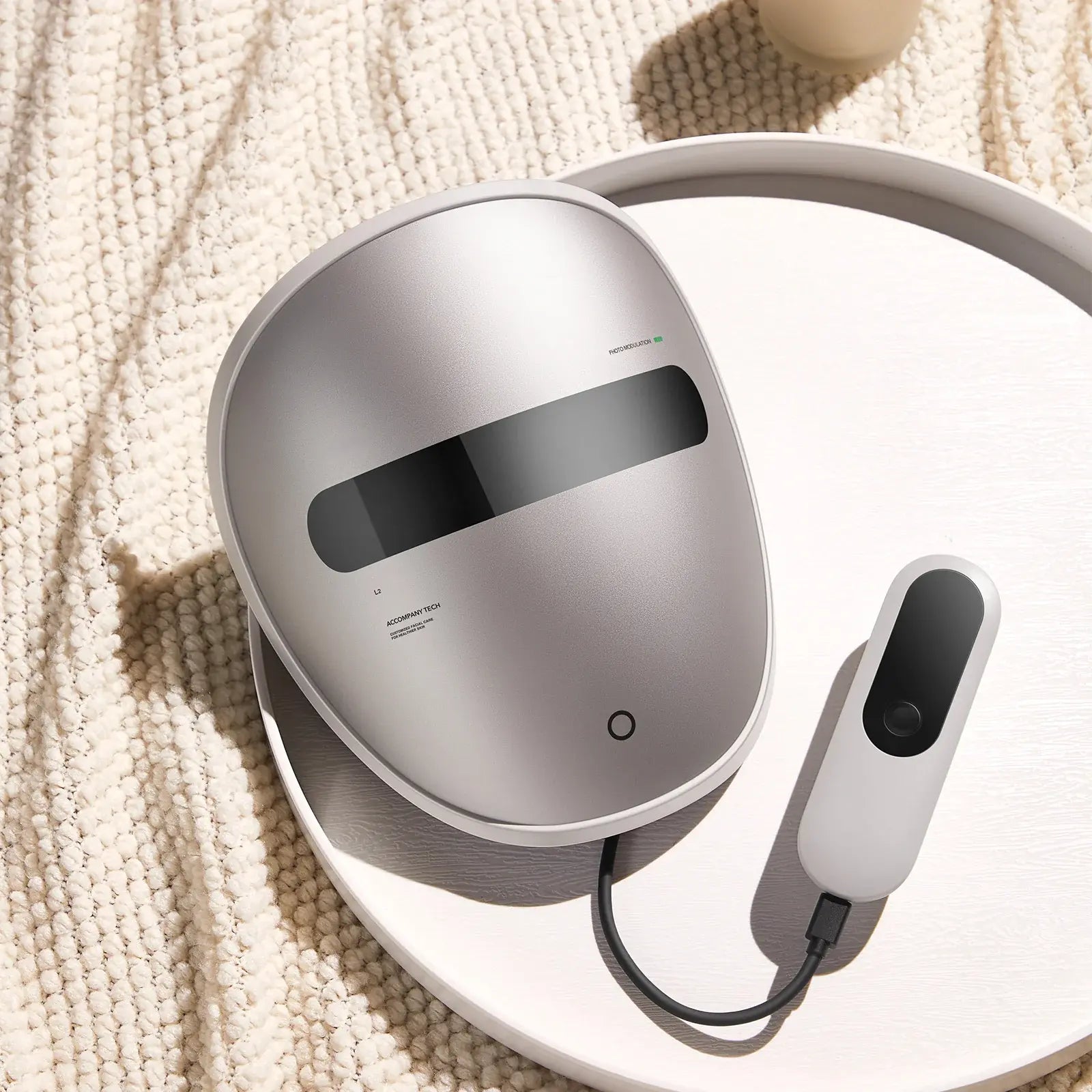 Dermao Luxon with a remote control on a textured surface