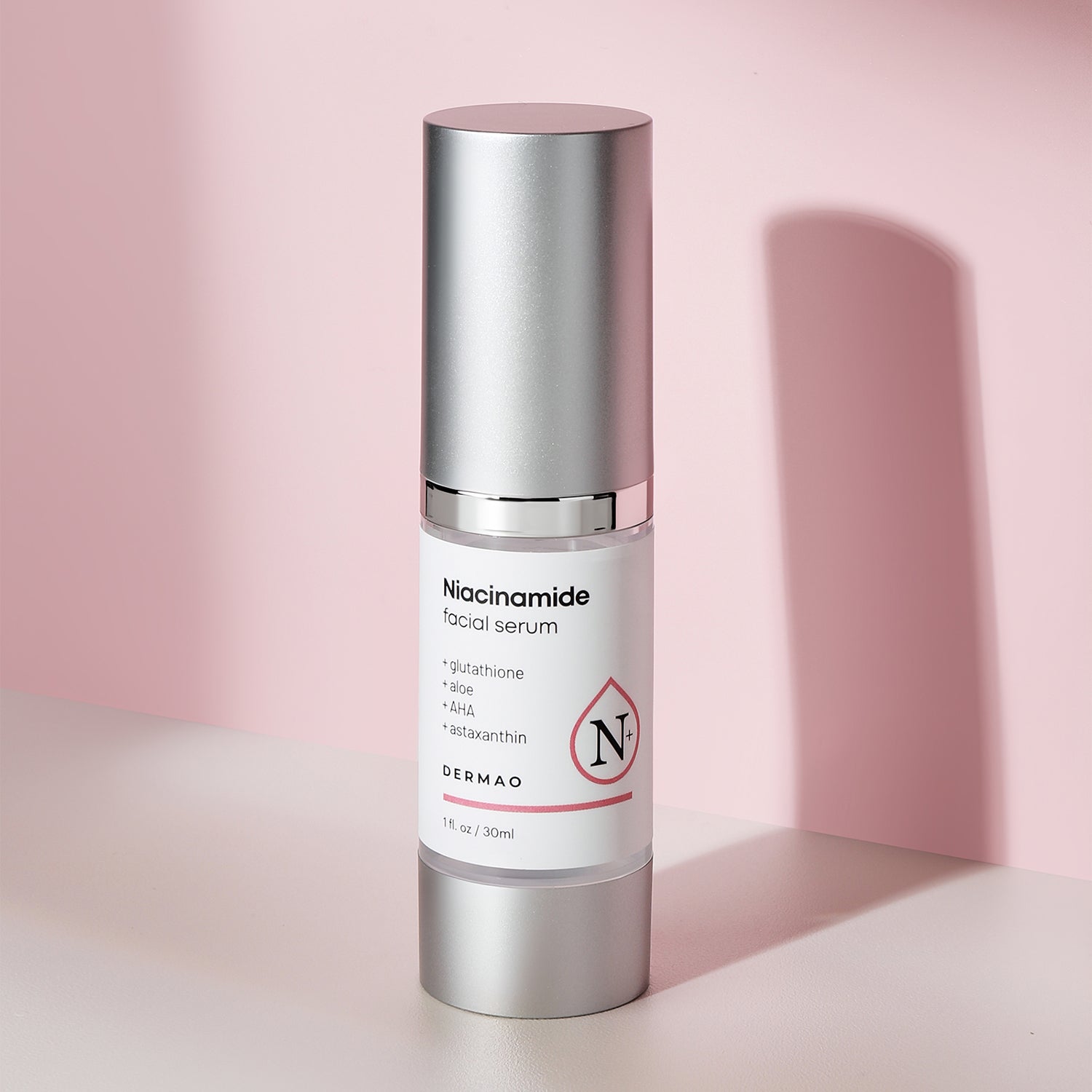 Niacinamide Facial Serum bottle on a pink background