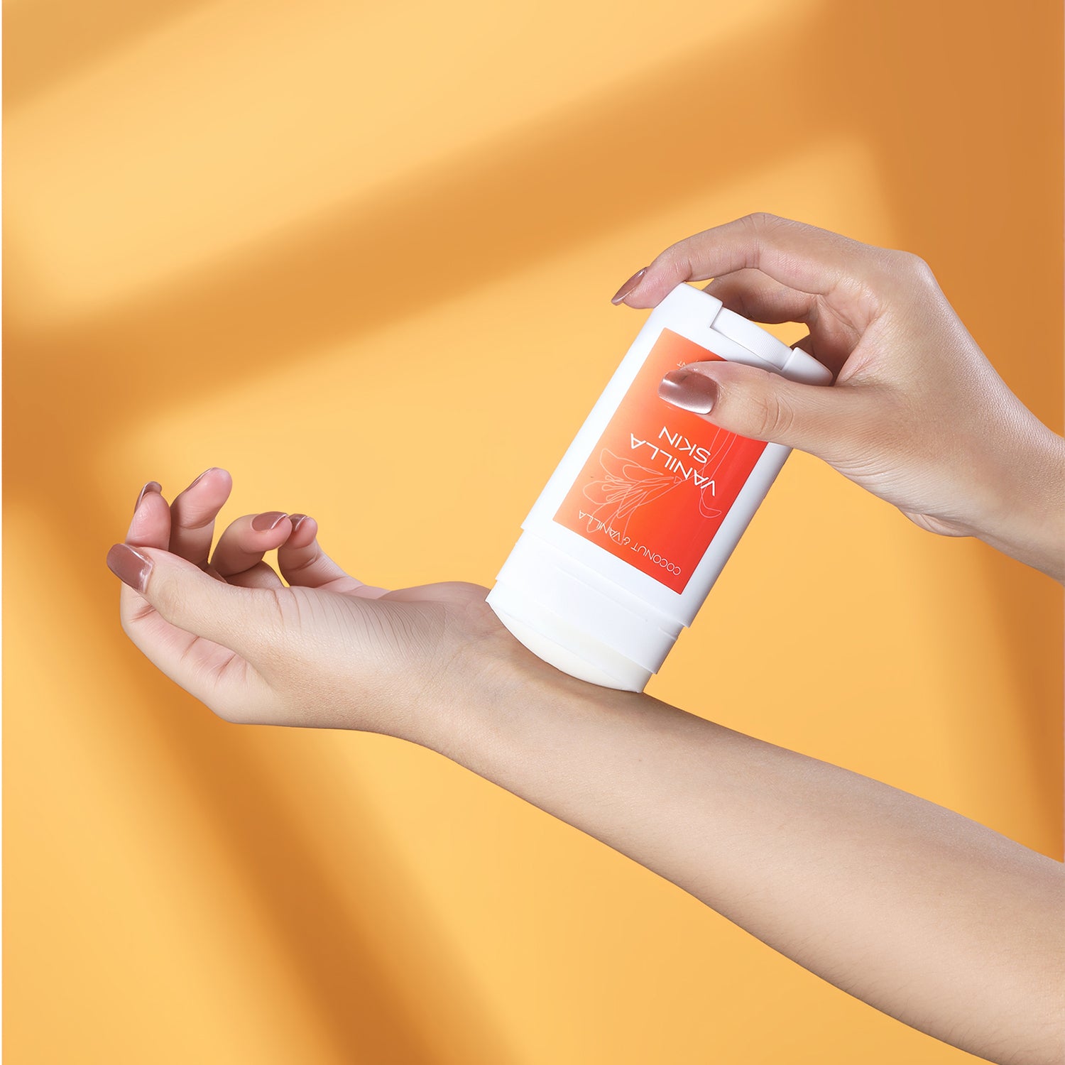 Person applying Vanilla Skin Deodorant on their wrist